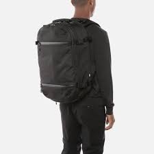 man carrying backpack